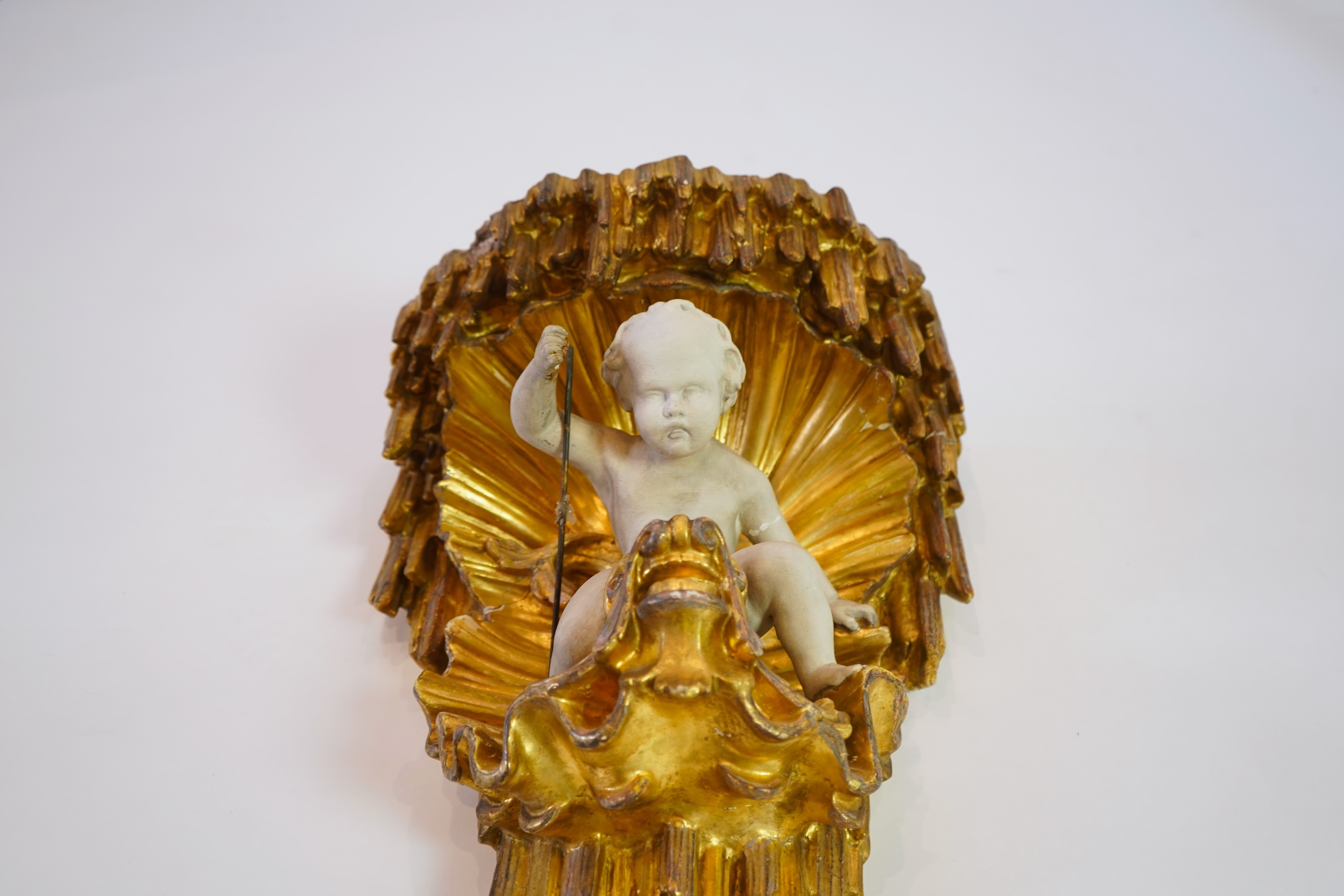 A late 18th / early 19th century carved and gilded wall bracket